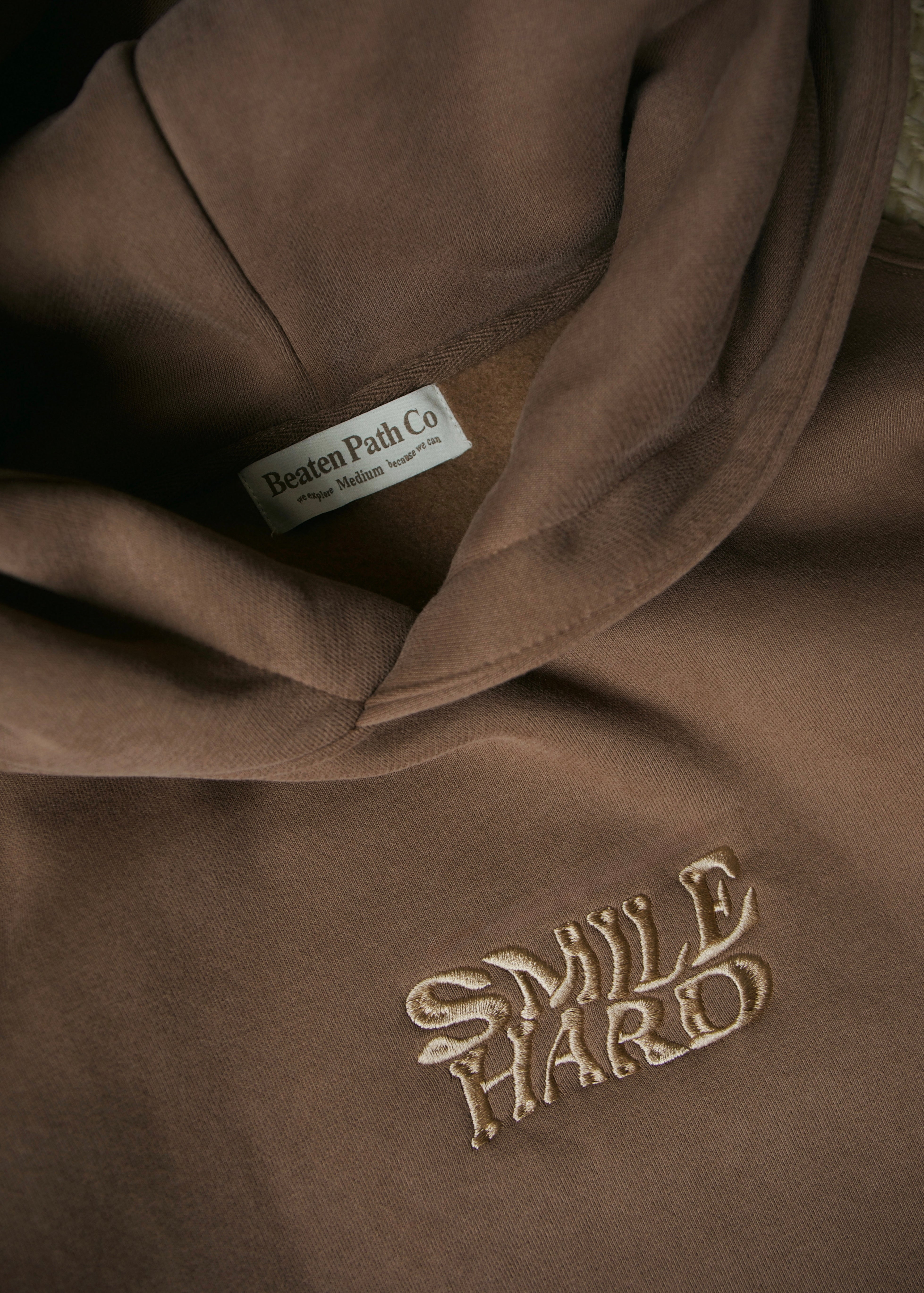 Beaten Path Co: SMILE HARD DEEP BROWN HOODIE