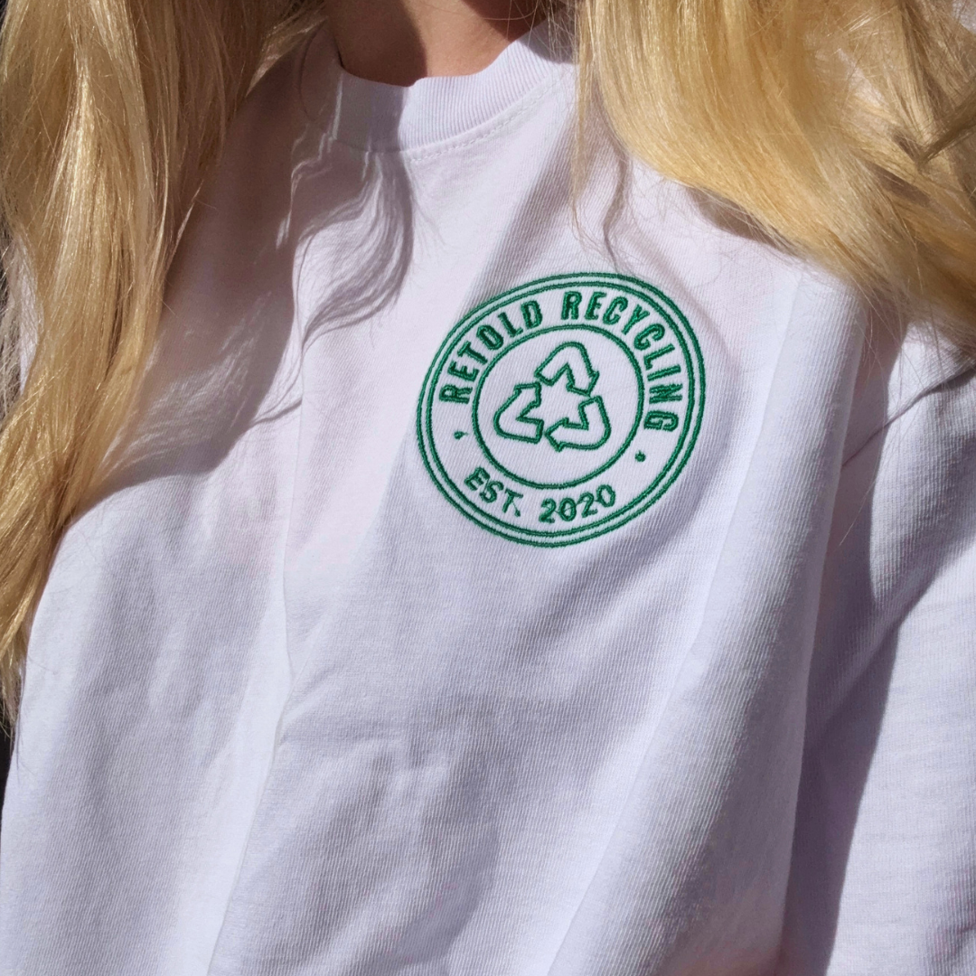 The Retold Emblem Tee