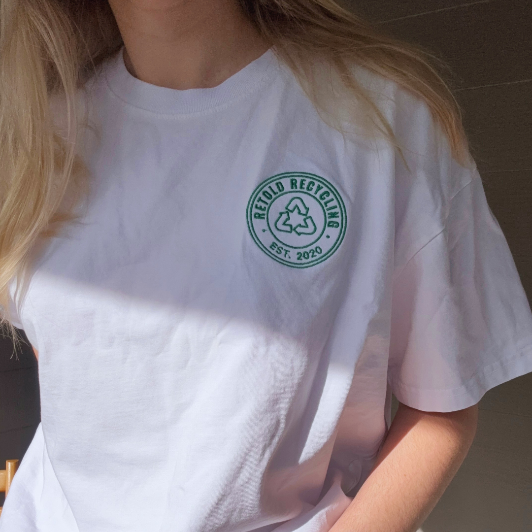 The Retold Emblem Tee